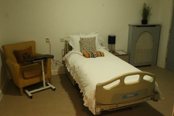 Private bedroom with armchair at Chestnut Rise Nursing Home, Rossington